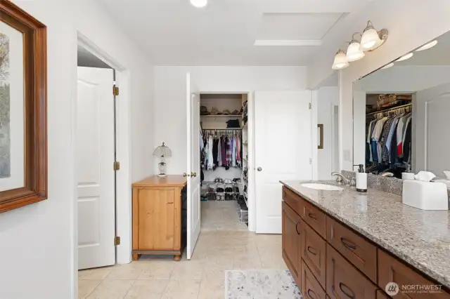 Primary bath with walk-in closet and radiant flooring