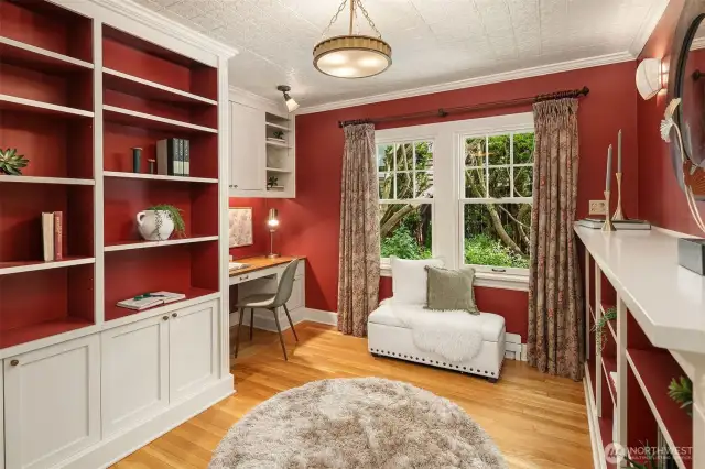 This office/den with beautiful built-in cabinets and desk could also be converted back to a 5th bedroom if needed.