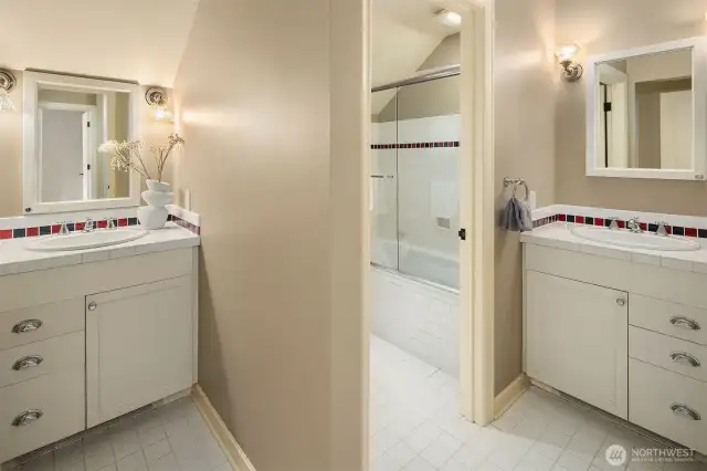 Full bath upstairs with two vanity areas.