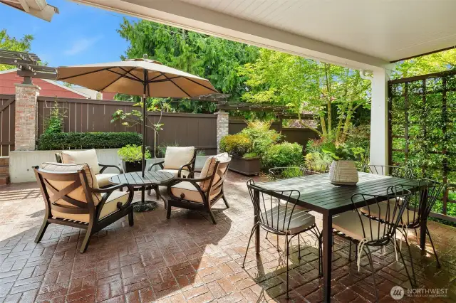 Elegant patio off of kitchen dining space is perfect for summer bbqs and gatherings.