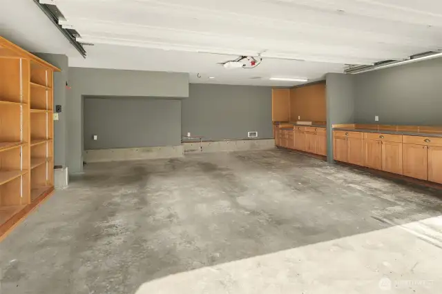 Two-car attached garage off of the alley with built-in storage.