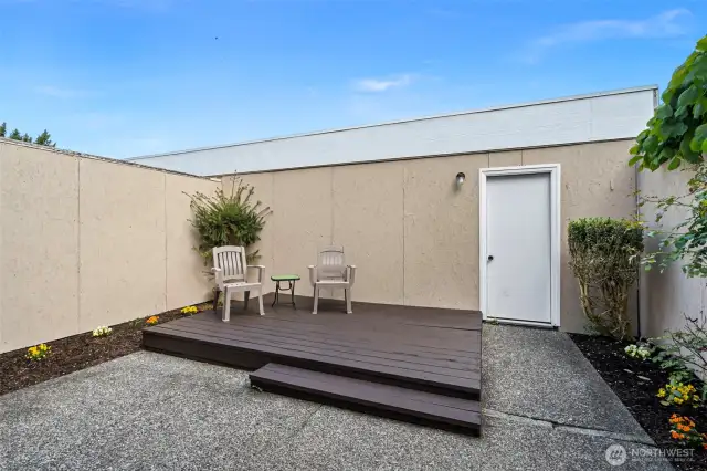 Private courtyard with deck and garage access