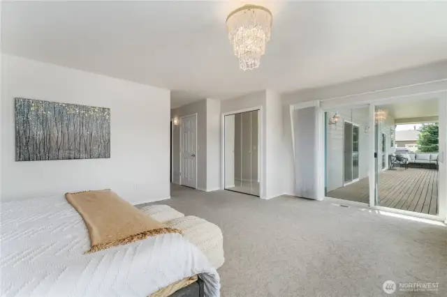 Primary bedroom with slider to deck