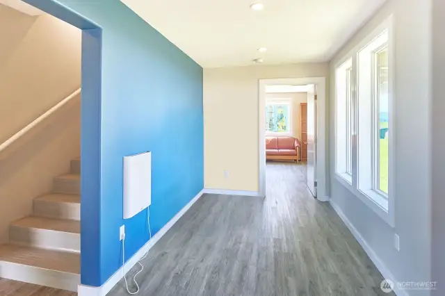 Entry from front door or garage, a perfect spot to shuck coats and boots.