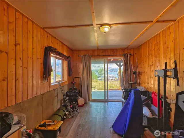 Bedroom 2 with slider to covered patio space and Lake Osoyoos views