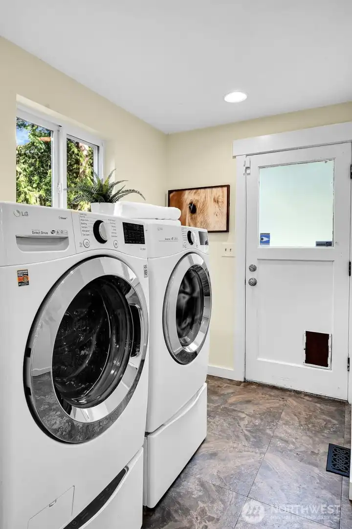 The utility room is just off of the kitchen and includes an exterior door.