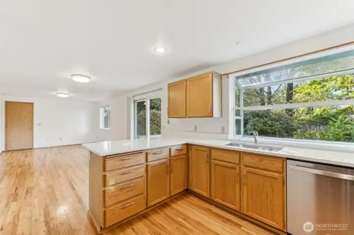 Kitchen looking into the additional family room. This area has beautiful hard wood floors.