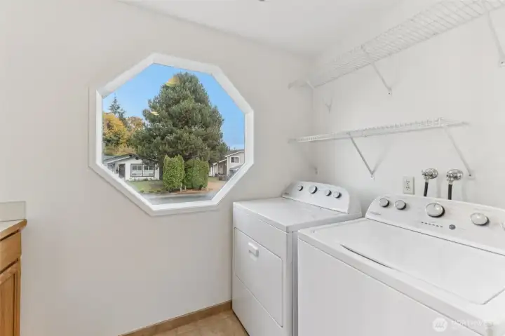 Bright cheery laundry room conveniently located upstairs.  Home comes with Washer and Dryer.