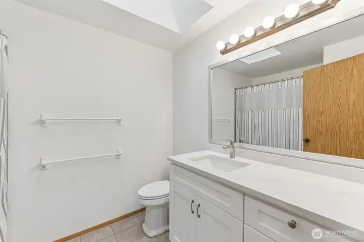 Upstairs hall bathroom has a new vanity and quartz countertop.