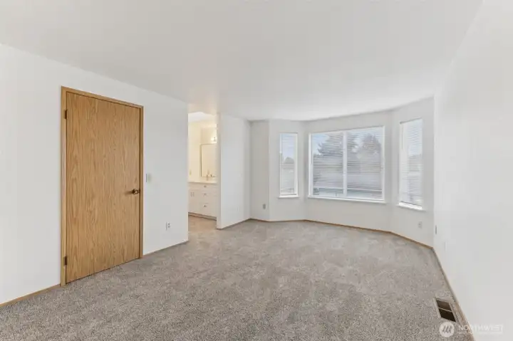 Primary bedroom with walk in closet and bathroom.