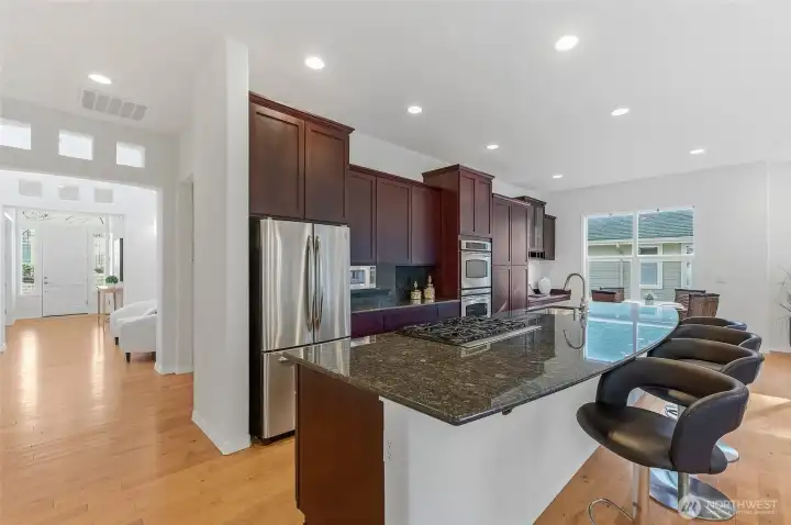 Slab granite counters and loads of cabinets.