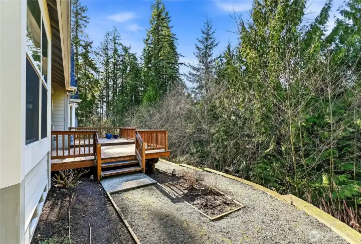 Off the deck is a garden bed and room to expand it. Or, this could be a nice spot for your four-legged friend!