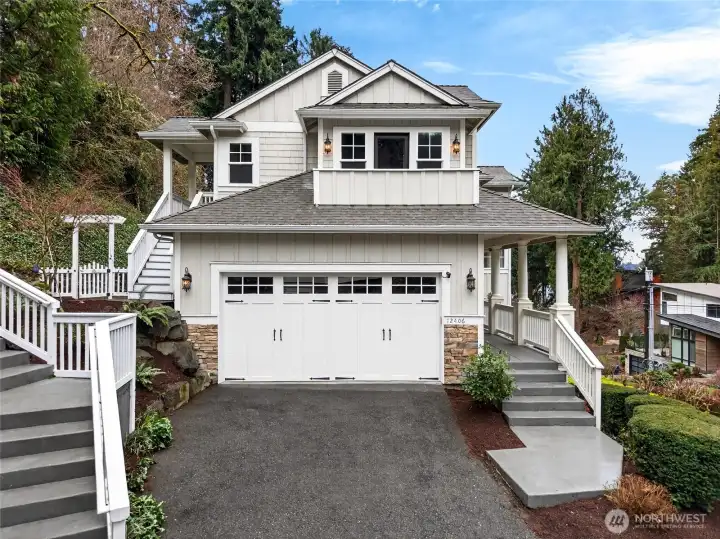 Front view of main house and 2 car garage
