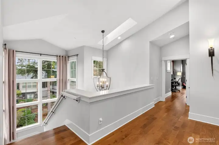 Floor to ceiling windows up staircase let in lots of natural light