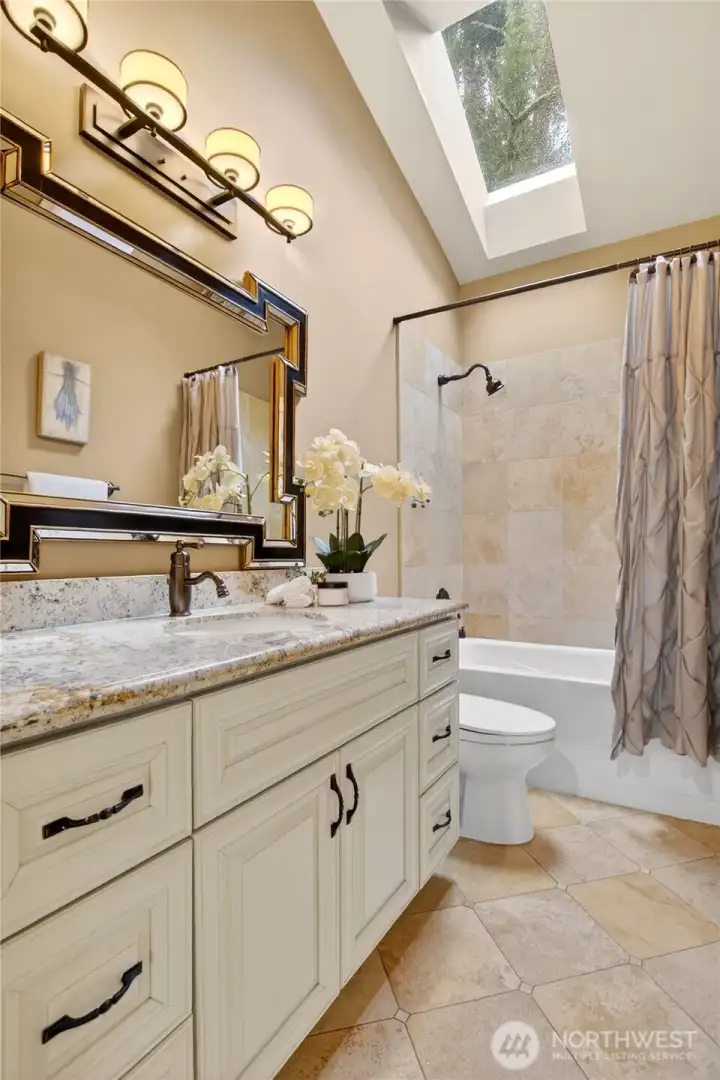 Guest bathroom lets light in with skylight