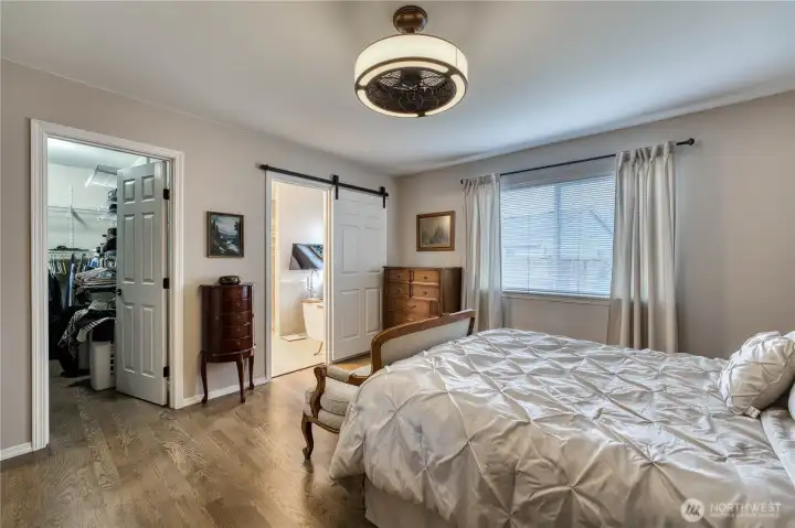 Walkin closet and sliding door to primary bath