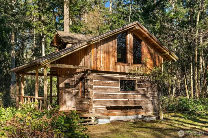 Rustic cabin was built in Lincoln, Montana, as a line cabin and moved to Vashon in the 1990s.