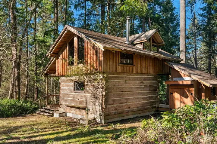 Outdoor faucet and shelf for the camp stove.