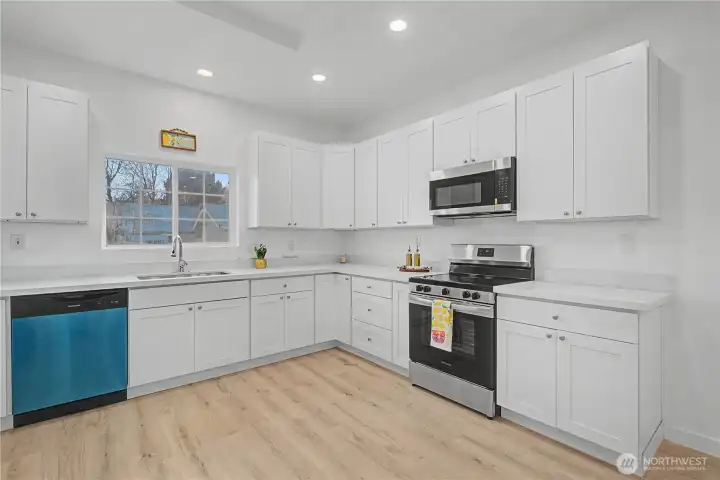 The gourmet kitchen features stainless steel appliances, quartz countertops, and vast, open-concept easy to accommodates a large crowd, with ample room for dining and socializing.