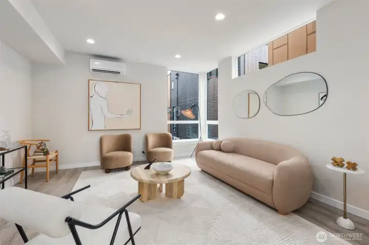 Large living room has ample space for a sectional, chairs, and entertainment center.  This picture does not do that space justice!