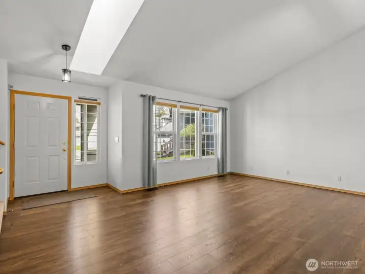 As you enter, you're greeted by the warmth of the rich laminate floors and natural light.