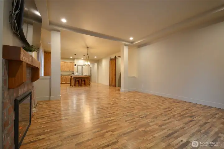 A beautiful barn door adds character while providing separation and privacy for the additional three bedrooms and laundry room.