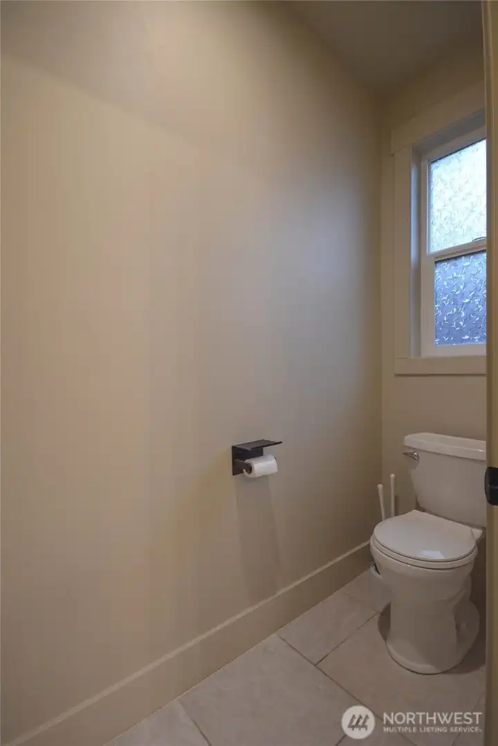 Private water closet offering a comfortable, well-sized and secluded space.