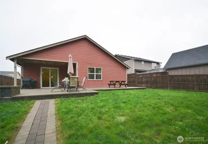 Paver walkway to the gate leading to the trails and the park area.
