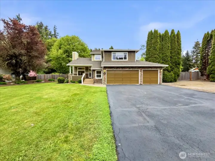 Front of home with ample parking and RV parking