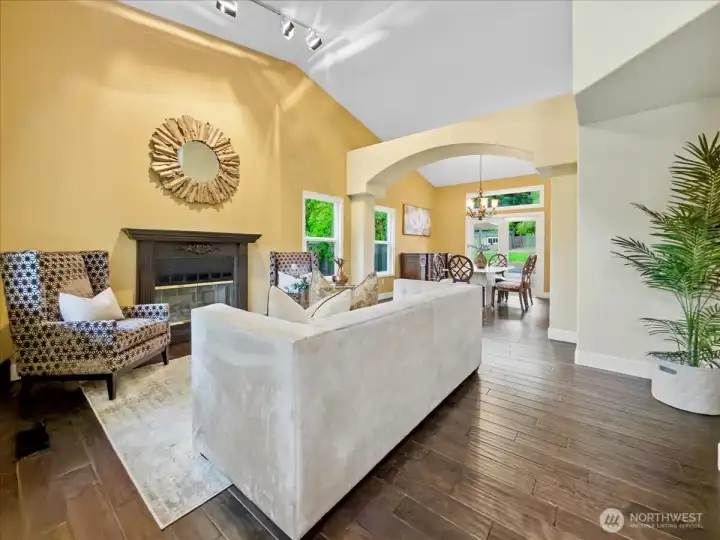 Living area off the entry with real wood floors.