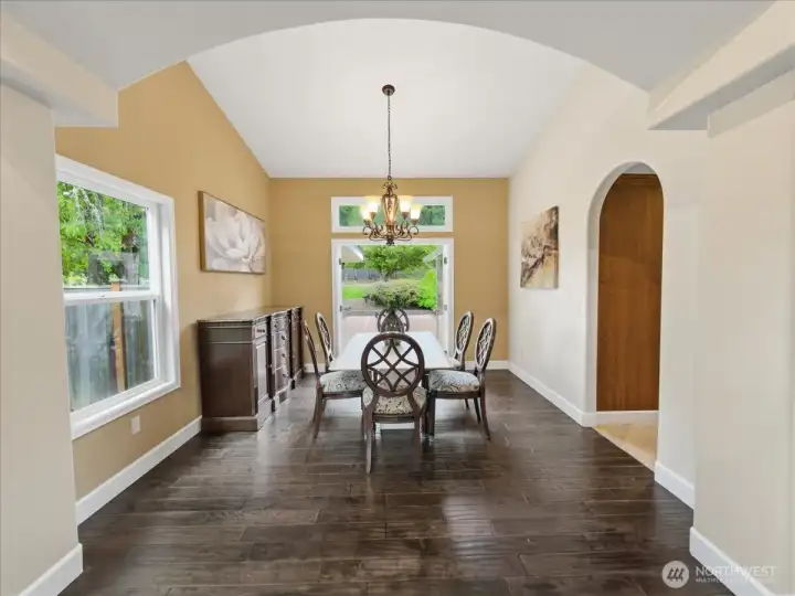 Separate dining area with real wood floors.