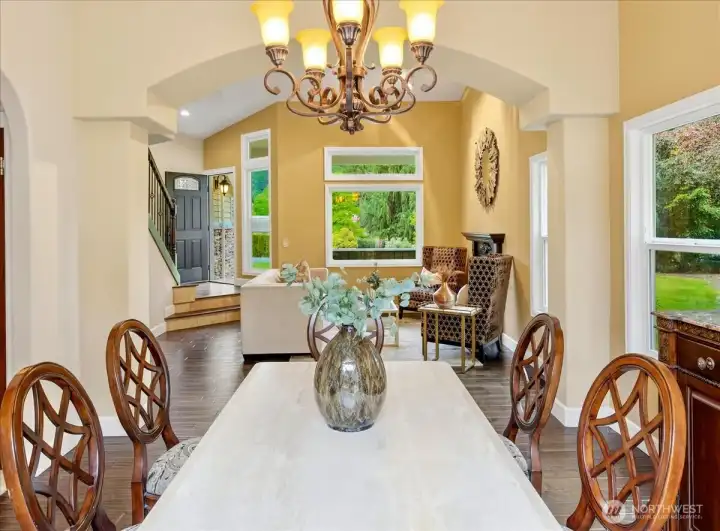 Separate dining area with real wood floors looking into the living area.