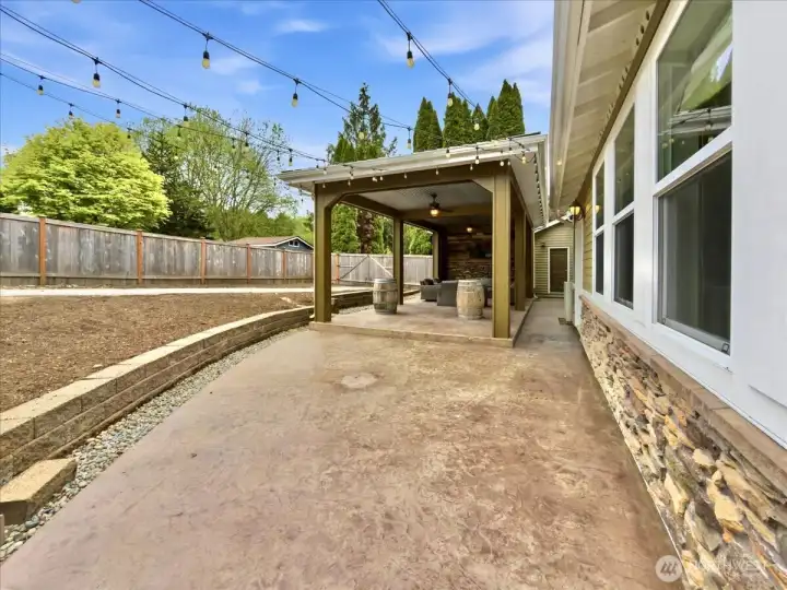 The backyard features a covered area with fans and TV perfect for entertaining no matter the weather. RV parking. A detached garage/shop and an additional shed.