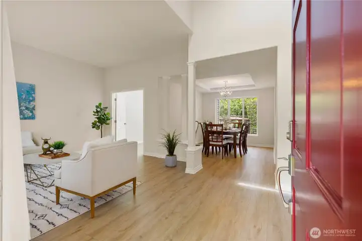 Entrance through the main door in the great room with the dinning room on the back and the office/studio in the corner