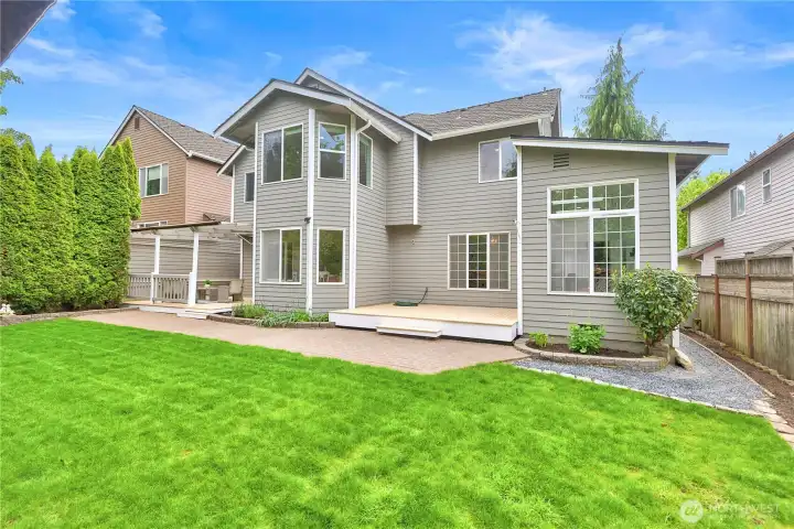 Back yard. Back of house with both decks