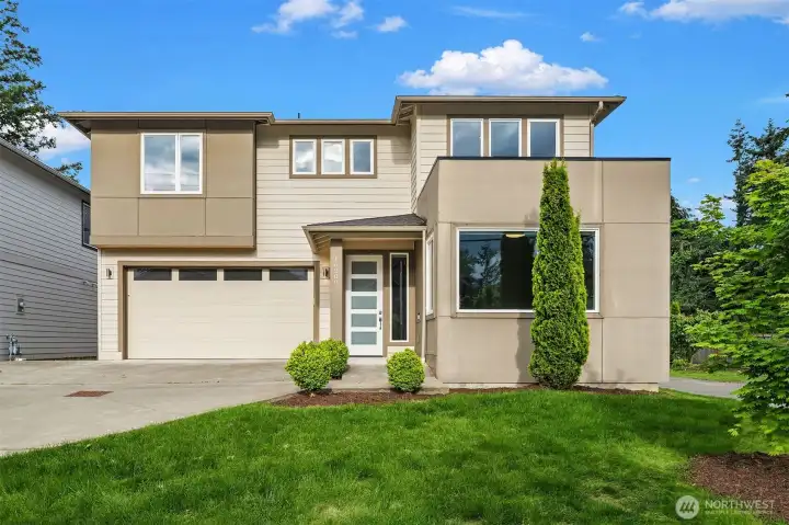 Modern elegance meets functional living in this beautifully designed 5-bedroom, 3-bath home in Renton’s desirable Spring Glen community. Built in 2019, this nearly 2,900 SF residence offers a rare main-level bedroom and full bath — ideal for guests or flexible living needs.     The expansive open-concept floorplan is filled with natural light and features luxury vinyl plank flooring, oversized windows, and a modern gas fireplace. The kitchen offers quartz countertops, a large center island, stainless steel appliances, walk-in pantry, and contemporary finishes throughout.     Upstairs, the spacious primary suite features a soaking tub, walk-in shower, and generous walk-in closet. Additional bedrooms and flexible living spaces provide room for a variety of lifestyles.