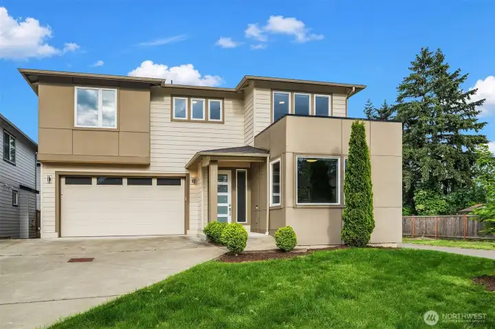 Modern elegance meets functional living in this beautifully designed 5-bedroom, 3-bath home in Renton’s desirable Spring Glen community. Built in 2019, this nearly 2,900 SF residence offers a rare main-level bedroom and full bath — ideal for guests or flexible living needs.     The expansive open-concept floorplan is filled with natural light and features luxury vinyl plank flooring, oversized windows, and a modern gas fireplace. The kitchen offers quartz countertops, a large center island, stainless steel appliances, walk-in pantry, and contemporary finishes throughout.     Upstairs, the spacious primary suite features a soaking tub, walk-in shower, and generous walk-in closet. Additional bedrooms and flexible living spaces provide room for a variety of lifestyles.