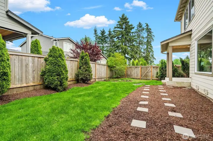 Fenced Low maintenance backyard.