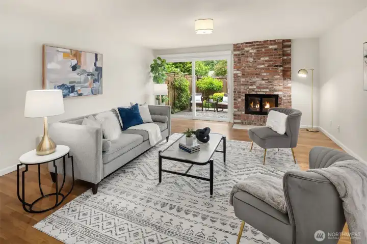 Spacious living space with cozy wood-burning fireplace and slider to private backyard with large patio Spacious living space with cozy wood-burning fireplace and slider to private backyard with large patio