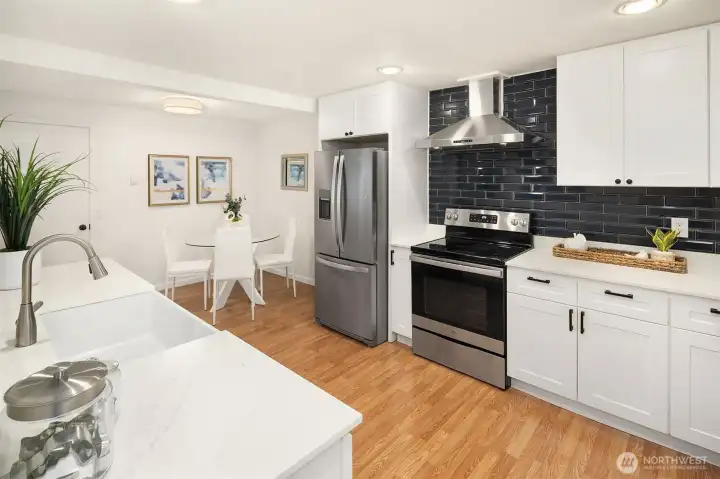 Remodeled kitchen with newer cabinets, appliances, counters and tile backsplash Remodeled kitchen with newer cabinets, appliances, counters and tile backsplash