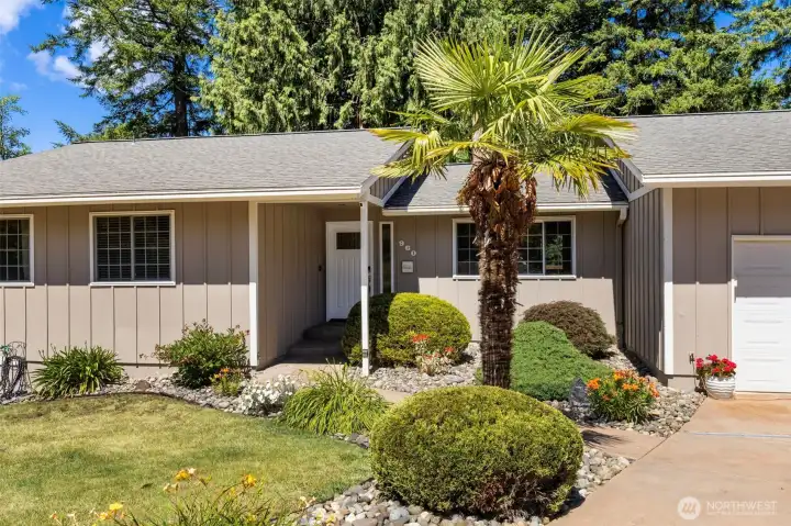 Mature easy care landscaping adorns this yard. Mature easy care landscaping adorns this yard.