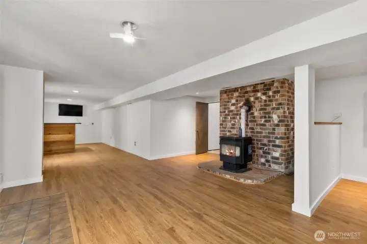 Looking to the wet bar and access to the upper main floor of the house. Looking to the wet bar and access to the upper main floor of the house.