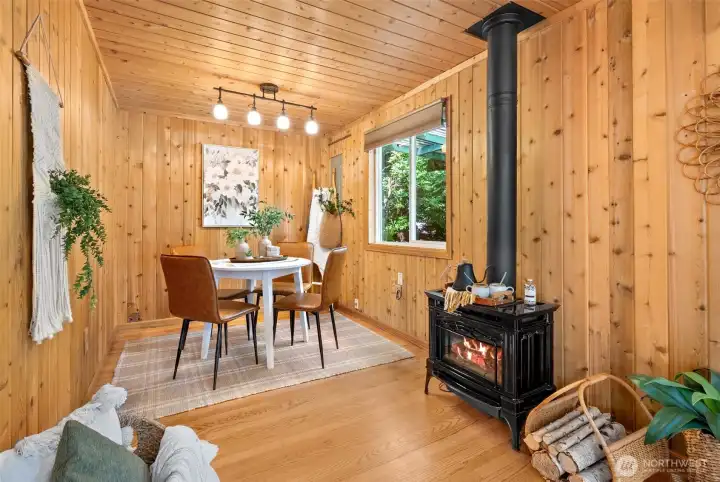 Dining room with natural light and standing stove
