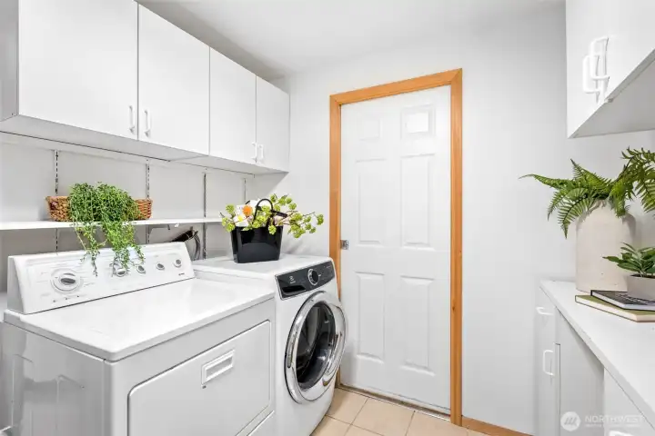 Oversized laundry room with plenty of storage