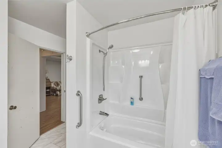 Tub in full bathroom.