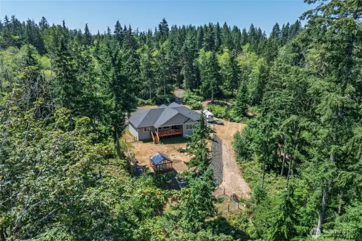 Trail is to the right through the trees of the pictured large cleared out section on right-side of home. A small, curved section of the trail is pictured above horse trailer @ top of photo. A postcard perfect, picturesque setting! Trail is to the right through the trees of the pictured large cleared out section on right-side of home. A small, curved section of the trail is pictured above horse trailer @ top of photo. A postcard perfect, picturesque setting!