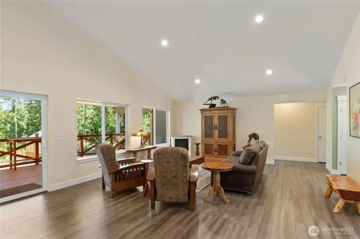 Hallway in back right of picture leads to the 2nd, and 3rd bedrooms. Hallway bathroom is off this wing too. The Primary bedroom is located behind kitchen area creating separation of bedrooms for added privacy. Hallway in back right of picture leads to the 2nd, and 3rd bedrooms. Hallway bathroom is off this wing too. The Primary bedroom is located behind kitchen area creating separation of bedrooms for added privacy.
