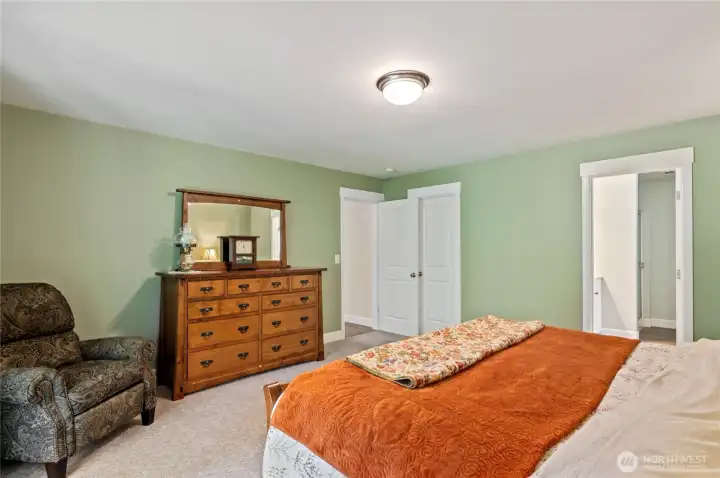 Primary suite. Doorway on right is to the 5-piece ensuite, door on left is to the spacious walk-in closet. Primary suite. Doorway on right is to the 5-piece ensuite, door on left is to the spacious walk-in closet.