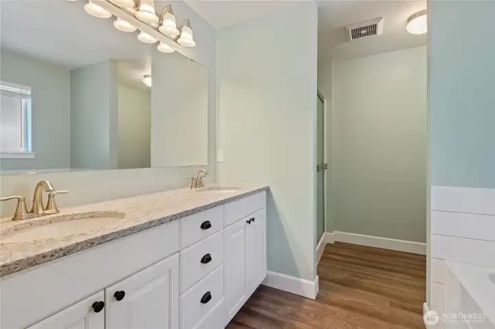 Primary bath with double sinks, soaking tub, and walk-in shower. Primary bath with double sinks, soaking tub, and walk-in shower.