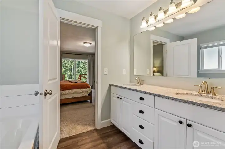 Another view of Primary bath. Large mirror with vibrant lighting and quartz countertops. Another view of Primary bath. Large mirror with vibrant lighting and quartz countertops.